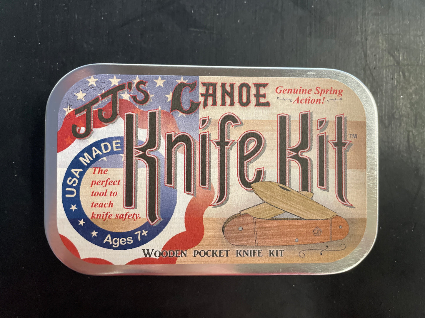 T.J.'s Canoe Knife Kit packaging on a dark background
