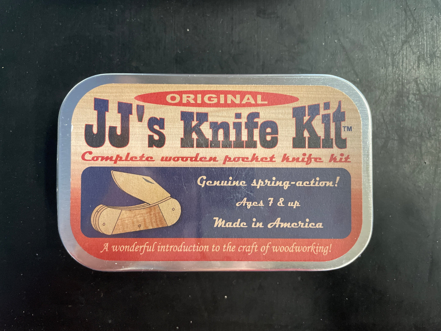 Vintage-style packaging for 'JJ's Knife Kit' on a dark background