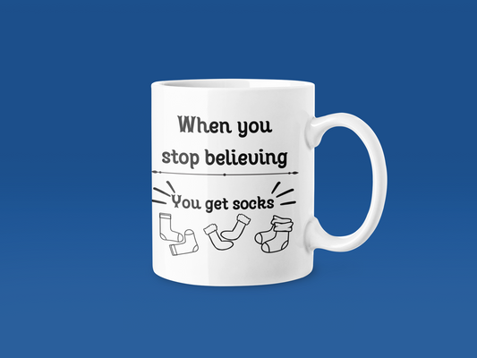 “When You Stop Believing, You Get Socks” – 11 oz Holiday Humor Mug